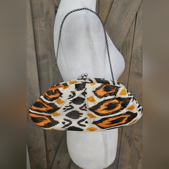 K.C.MALHAN Ikat Printed Woven Cloth Dumpling Chain Bag In Orange/brown Multi. - Picture 10 of 11